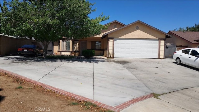 37901 Rosemarie St, Palmdale, CA 93550 - ranch-style house with stucco siding, concrete driveway, and an attached garage