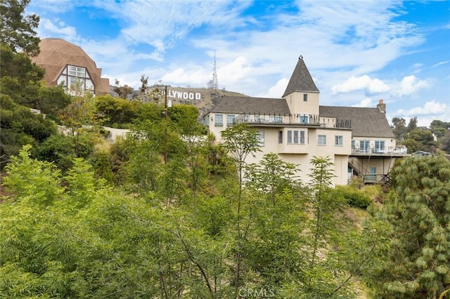 3102 Durand Dr, Los Angeles, CA 90068 - back of property with stucco siding and a chimney