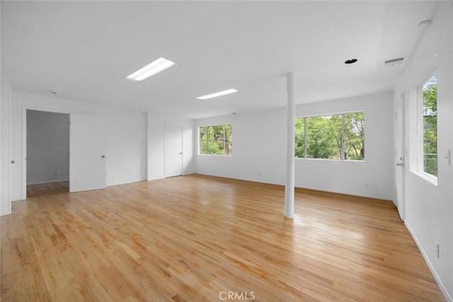 3102 Durand Dr, Los Angeles, CA 90068 - empty room featuring light wood-type flooring, healthy amount of natural light, and baseboards