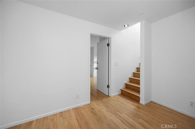 3102 Durand Dr, Los Angeles, CA 90068 - empty room with light wood-style flooring, stairway, and baseboards