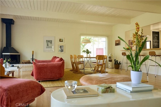 3102 Durand Dr, Los Angeles, CA 90068 - living room featuring wood ceiling with exposed beams, wood finished floors, and a wood stove