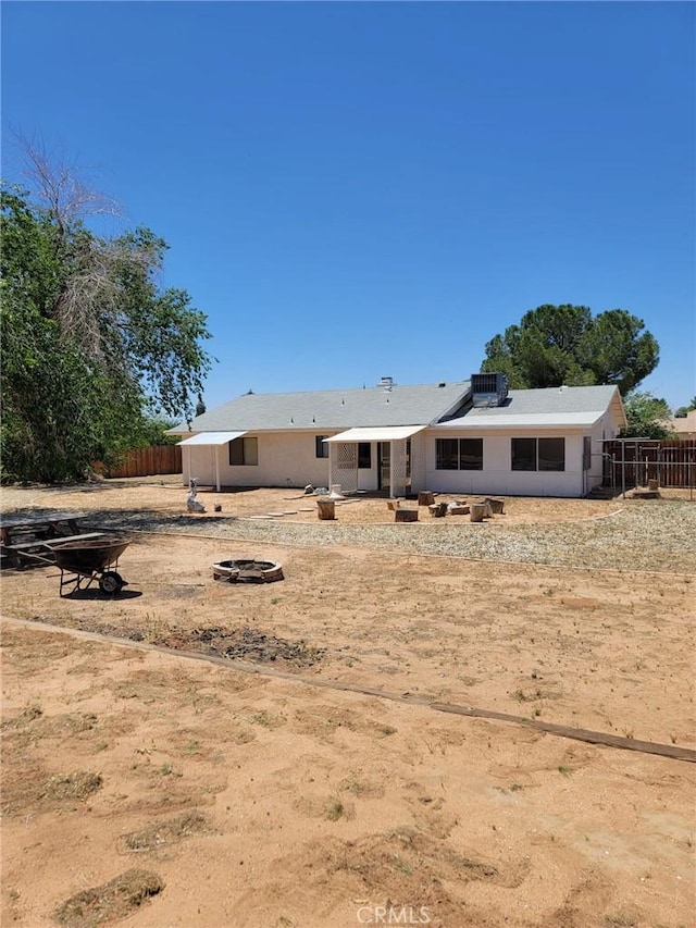 12787 Algonquin Rd, Apple Valley, CA 92308 - rear view of house featuring a patio and solar panels