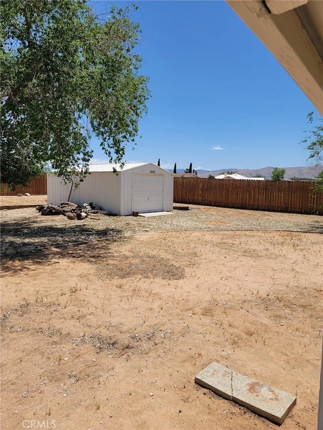 12787 Algonquin Rd, Apple Valley, CA 92308 - view of yard with an outdoor structure
