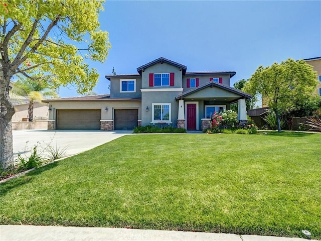 8242 Daisy Ln, Riverside, CA 92508 - view of front of home featuring stone siding, stucco siding, driveway, and an attached garage