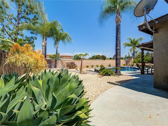 8242 Daisy Ln, Riverside, CA 92508 - fenced backyard with a patio area