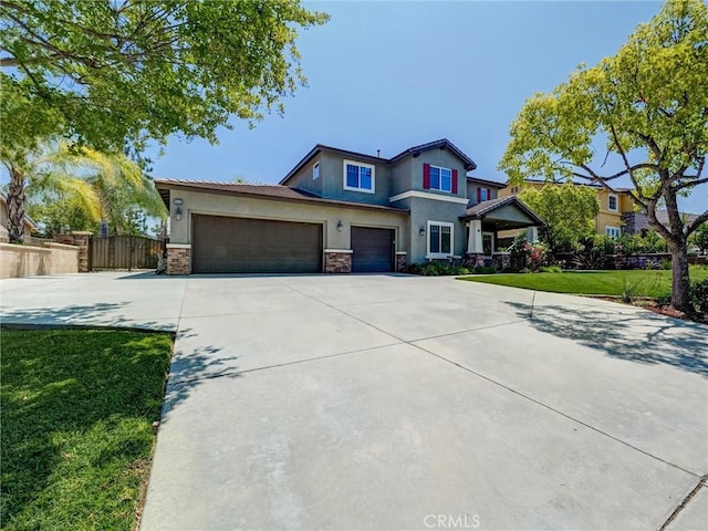 8242 Daisy Ln, Riverside, CA 92508 - view of front facade with stucco siding, driveway, stone siding, and a garage
