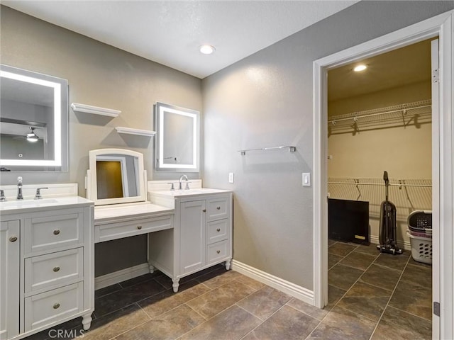 8242 Daisy Ln, Riverside, CA 92508 - full bath featuring vanity, baseboards, a walk in closet, and recessed lighting