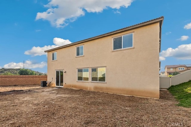 14226 Sonoma Ct, Beaumont, CA 92223 - rear view of house featuring central AC unit and stucco siding