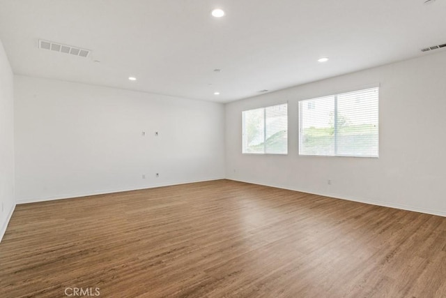 14226 Sonoma Ct, Beaumont, CA 92223 - unfurnished room with wood finished floors, recessed lighting, and baseboards