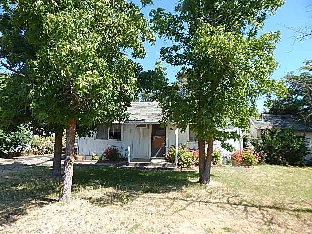 2018 Donnovan Ave, Corning, CA 96021 - view of property hidden behind natural elements with a front yard