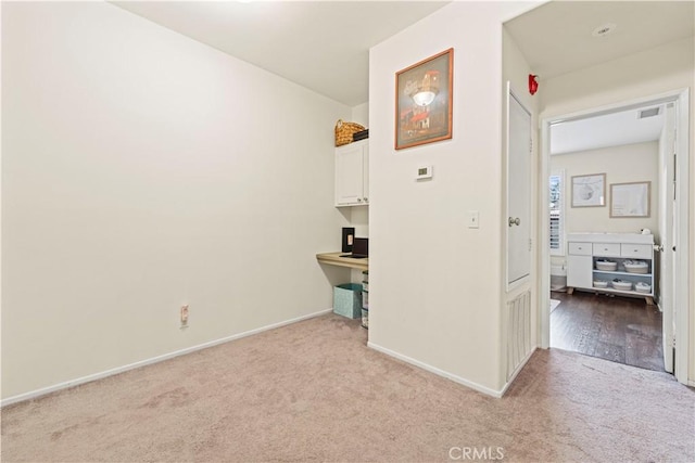 23411 Abbey Glen Pl Unit 41, Valencia, CA 91354 - hall with light carpet, baseboards, and a desk
