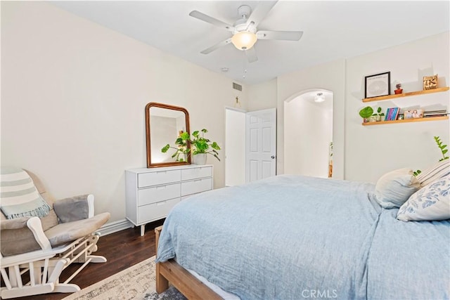 23411 Abbey Glen Pl Unit 41, Valencia, CA 91354 - bedroom featuring wood finished floors, arched walkways, baseboards, and ceiling fan