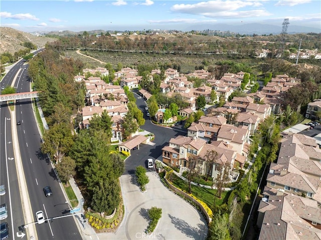 23411 Abbey Glen Pl Unit 41, Valencia, CA 91354 - aerial overview of property's location with nearby suburban area and a mountain backdrop