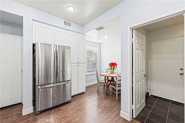 23411 Abbey Glen Pl Unit 41, Valencia, CA 91354 - kitchen with freestanding refrigerator, white cabinetry, dark wood-style flooring, and baseboards