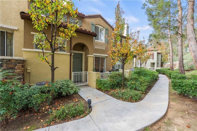 23411 Abbey Glen Pl Unit 41, Valencia, CA 91354 - view of front facade featuring stucco siding