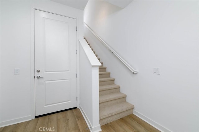 1075 Cadence, Irvine, CA 92618 - stairs featuring wood finished floors and baseboards