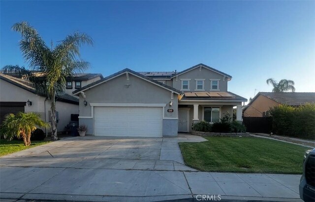1413 La Quinta Way, Madera, CA 93638 - traditional-style home featuring a garage, a front lawn, stucco siding, and concrete driveway
