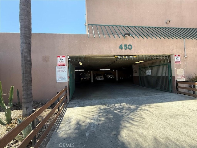 450 E 4th St Unit 207, Santa Ana, CA 92701 - view of building exterior with concrete driveway and a garage
