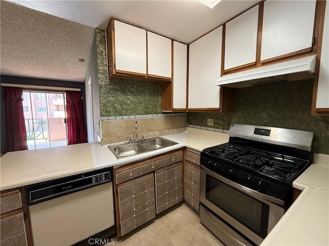 450 E 4th St Unit 207, Santa Ana, CA 92701 - kitchen featuring stainless steel gas stove, white dishwasher, a sink, under cabinet range hood, and white cabinetry