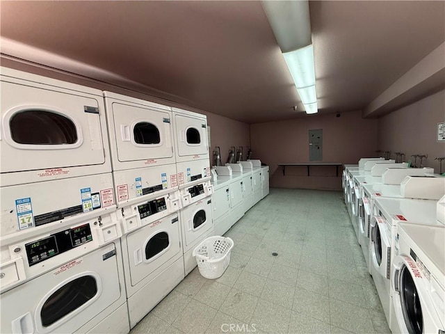 450 E 4th St Unit 207, Santa Ana, CA 92701 - communal laundry room with washer and clothes dryer, stacked washer / dryer, electric panel, and light flooring