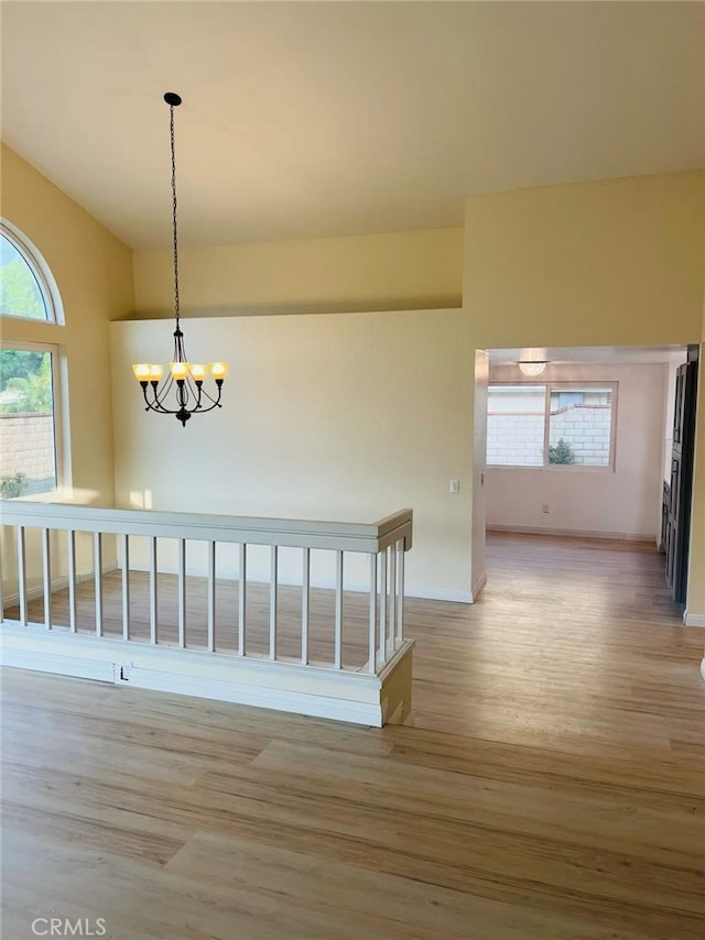 1202 Longview Dr, Diamond Bar, CA 91765 - stairs with wood finished floors, a chandelier, plenty of natural light, vaulted ceiling, and baseboards