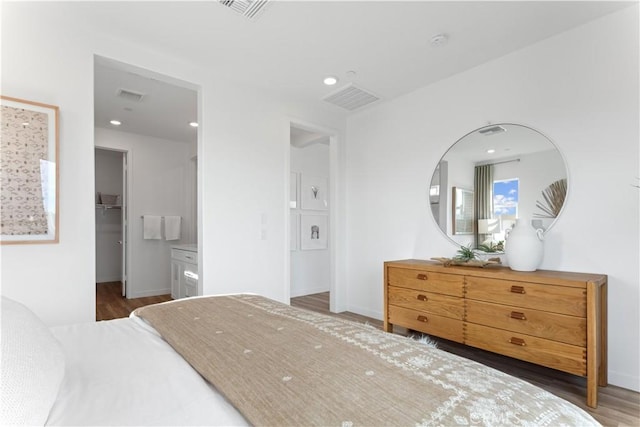 3260 Garnet Ln, Lancaster, CA 93535 - bedroom with a spacious closet, wood finished floors, and baseboards