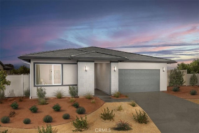 3260 Garnet Ln, Lancaster, CA 93535 - view of front of property with an attached garage, concrete driveway, and a tile roof
