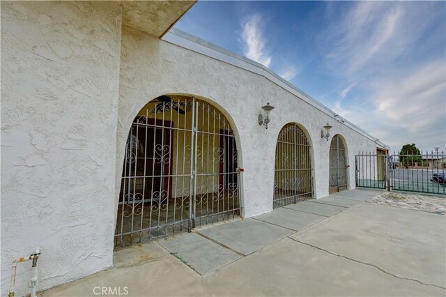 16811 Via Quedo, Desert Hot Springs, CA 92240 - entrance to property with a gate and stucco siding