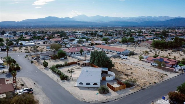 16811 Via Quedo, Desert Hot Springs, CA 92240 - aerial perspective of suburban area with a mountain backdrop