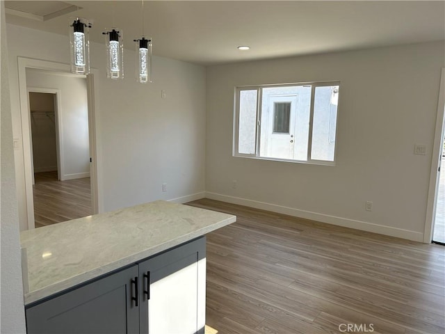 2033 W Burnett St, Long Beach, CA 90810 - unfurnished dining area with light wood-style flooring, baseboards, and recessed lighting