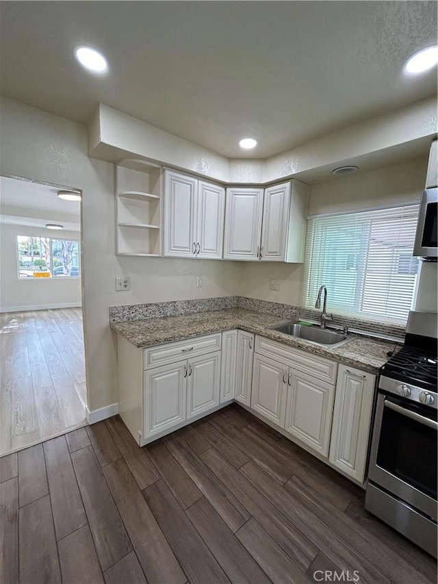 2033 W Burnett St, Long Beach, CA 90810 - kitchen with a sink, stainless steel appliances, dark wood finished floors, white cabinets, and recessed lighting