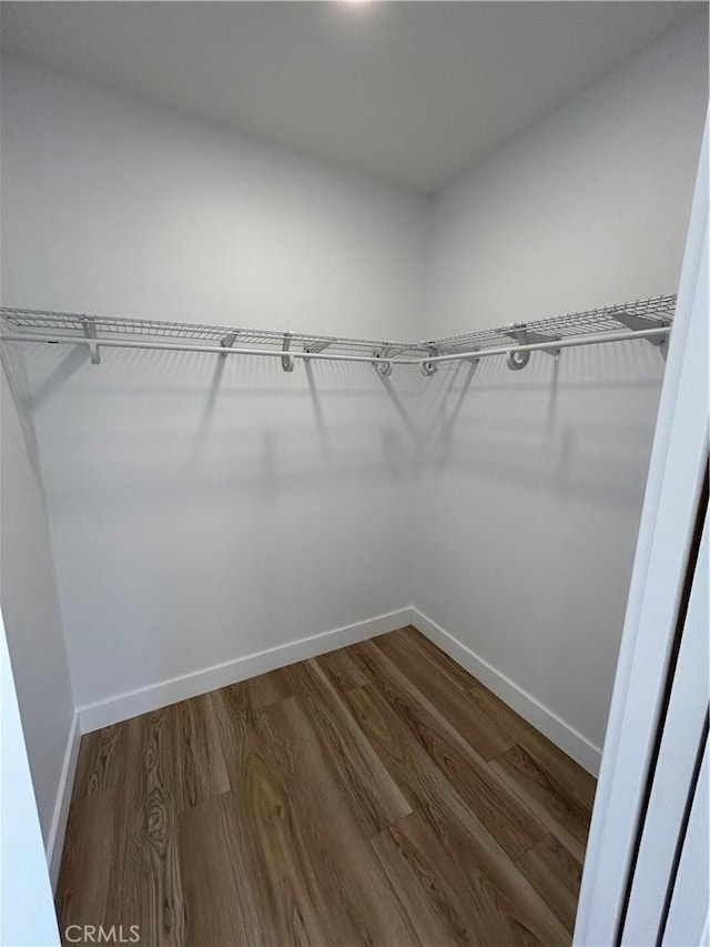 2033 W Burnett St, Long Beach, CA 90810 - walk in closet featuring wood finished floors