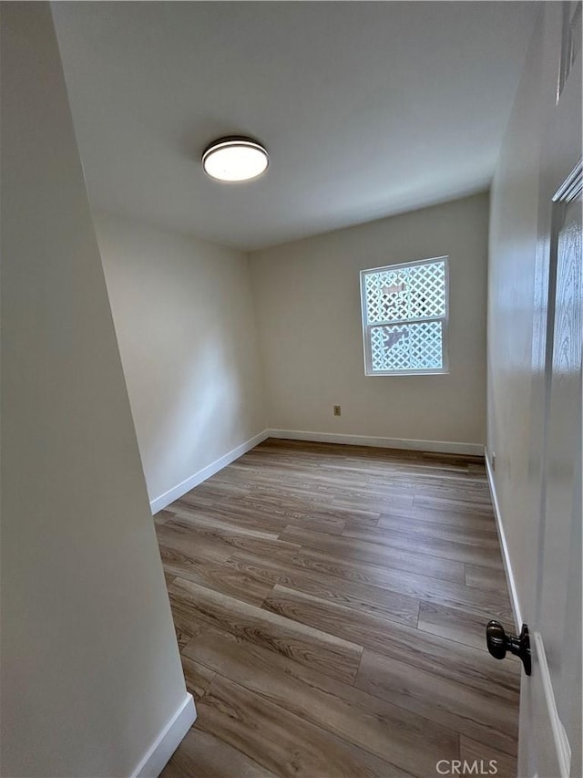 2033 W Burnett St, Long Beach, CA 90810 - spare room with wood finished floors and baseboards