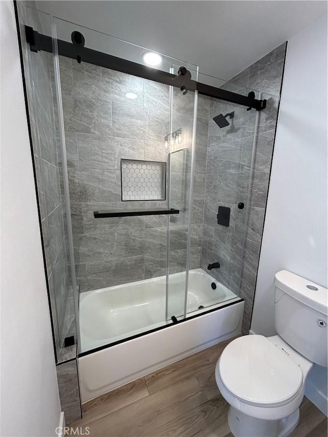 2033 W Burnett St, Long Beach, CA 90810 - bathroom with shower / bath combination with glass door, toilet, and wood finished floors