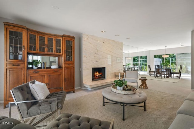 1045 S Orange Grove Blvd Unit 8, Pasadena, CA 91105 - living area with light carpet and a premium fireplace