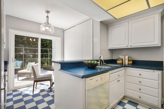 1045 S Orange Grove Blvd Unit 8, Pasadena, CA 91105 - kitchen featuring white dishwasher, light floors, a sink, dark countertops, and a peninsula