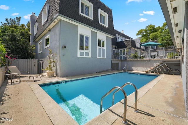 1045 S Orange Grove Blvd Unit 8, Pasadena, CA 91105 - view of swimming pool featuring a patio area and stairway