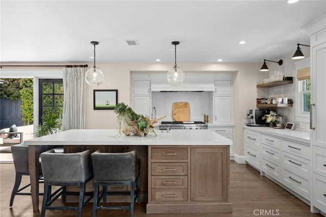 620 Brooks St, Laguna Beach, CA 92651 - kitchen with plenty of natural light, light countertops, recessed lighting, a breakfast bar, and white cabinetry