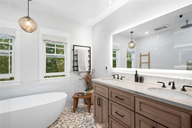 620 Brooks St, Laguna Beach, CA 92651 - bathroom with a freestanding tub, tile walls, double vanity, a marble finish shower, and recessed lighting
