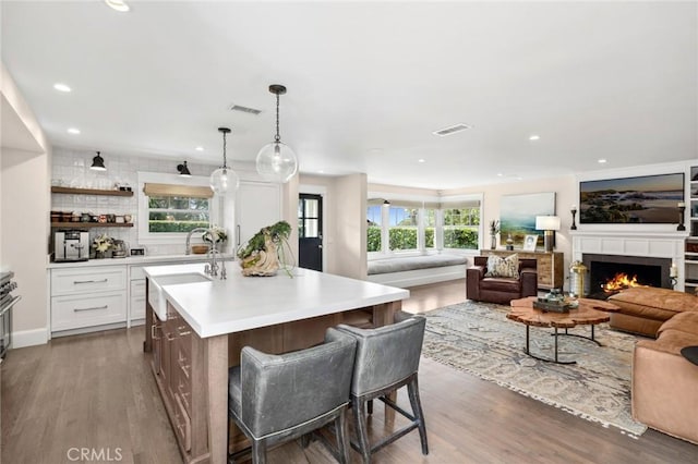 620 Brooks St, Laguna Beach, CA 92651 - kitchen with light countertops, a kitchen island with sink, recessed lighting, white cabinetry, and open floor plan