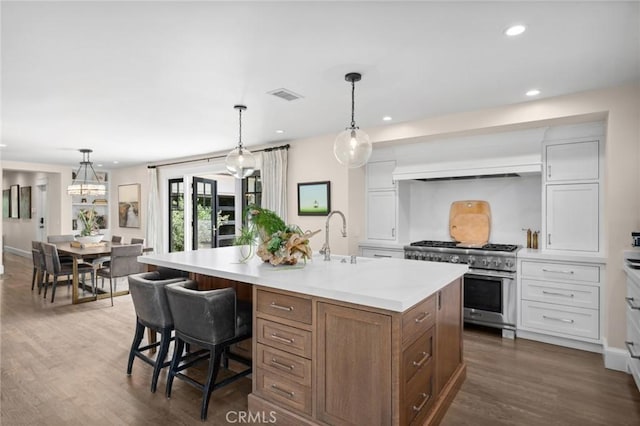 620 Brooks St, Laguna Beach, CA 92651 - kitchen with stainless steel range, a sink, light countertops, dark wood-type flooring, and recessed lighting