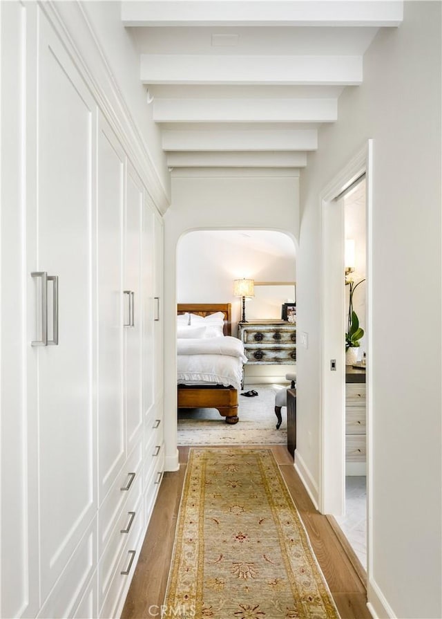 31847 8th Ave, Laguna Beach, CA 92651 - bedroom with arched walkways, wood finished floors, and beam ceiling