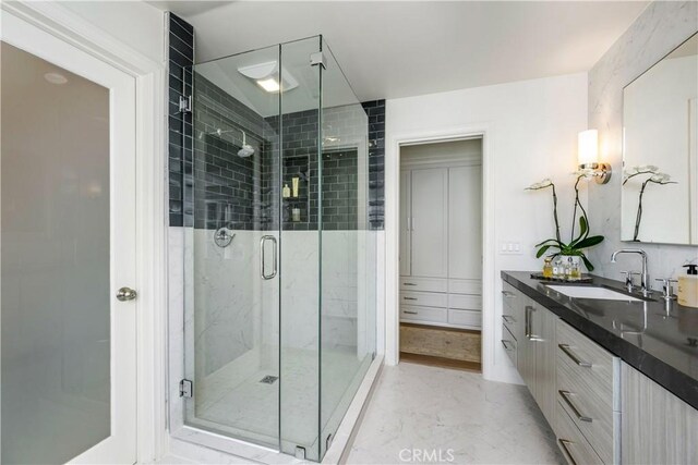 31847 8th Ave, Laguna Beach, CA 92651 - bathroom featuring vanity, a stall shower, and marble finish floors