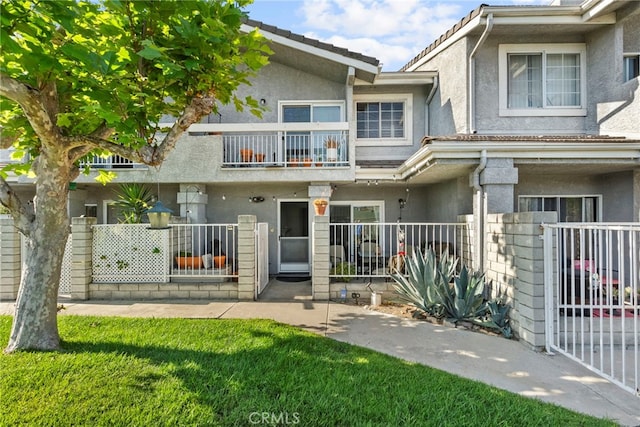 21817 Figueroa St Unit 5, Carson, CA 90745 - view of property with a balcony and stucco siding