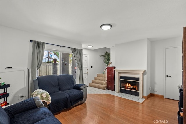 21817 Figueroa St Unit 5, Carson, CA 90745 - living room featuring light wood-style floors and a fireplace with flush hearth