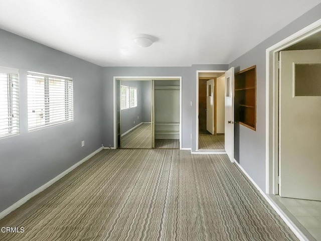 5021 Alvarado St, Carpinteria, CA 93013 - unfurnished bedroom with a closet and carpet flooring
