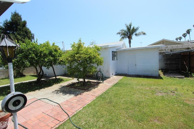 5021 Alvarado St, Carpinteria, CA 93013 - back of property with stucco siding and a patio
