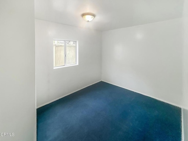 5021 Alvarado St, Carpinteria, CA 93013 - spare room featuring dark colored carpet and baseboards