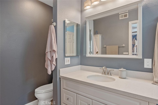 27702 Quincy St, Castaic, CA 91384 - bathroom with toilet, vanity, and a textured wall