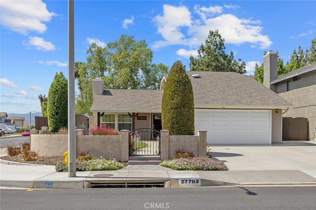 27702 Quincy St, Castaic, CA 91384 - view of front of house with a gate, a garage, driveway, and a fenced front yard